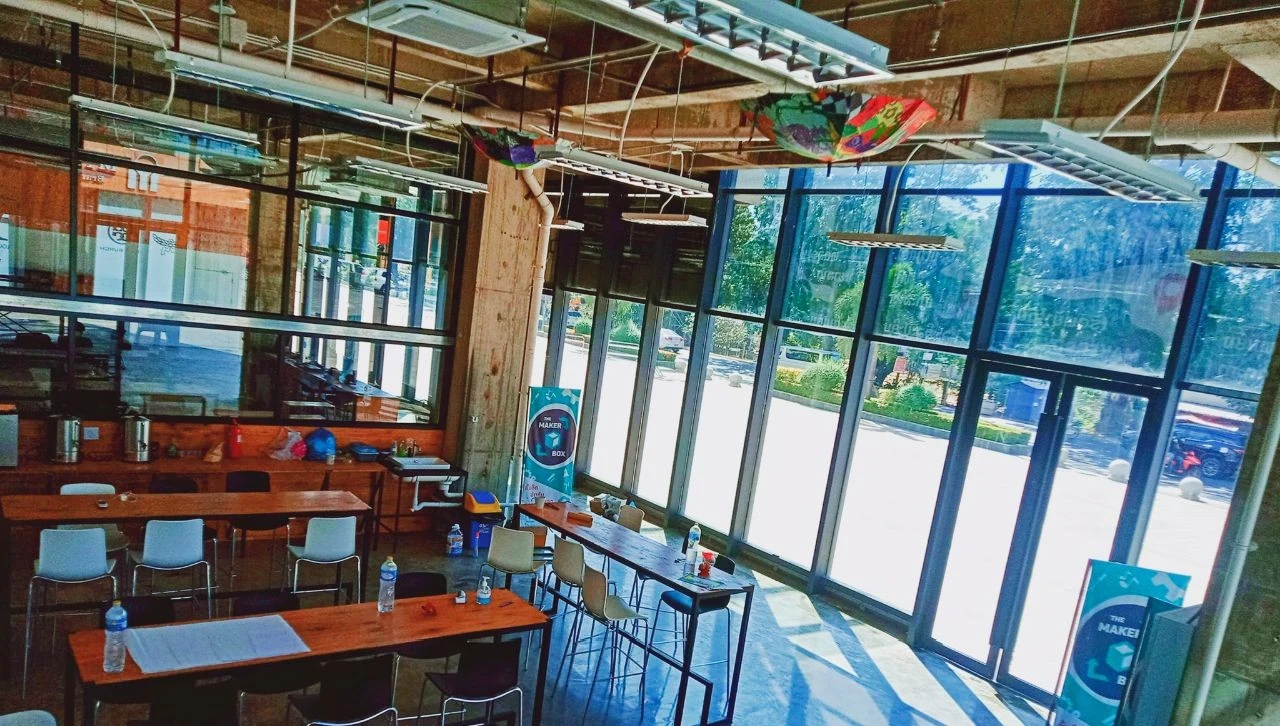 The interior of Makerbox Lao with work tables and equipment